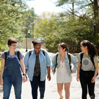 Students talking and walking on campus