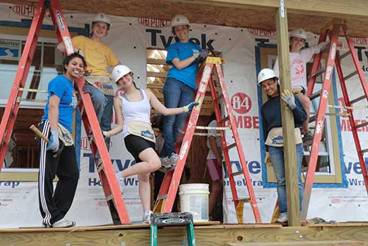 Students helping building homes