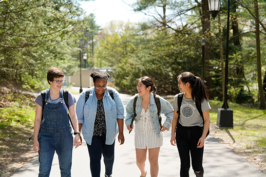 Students talking and walking on campus